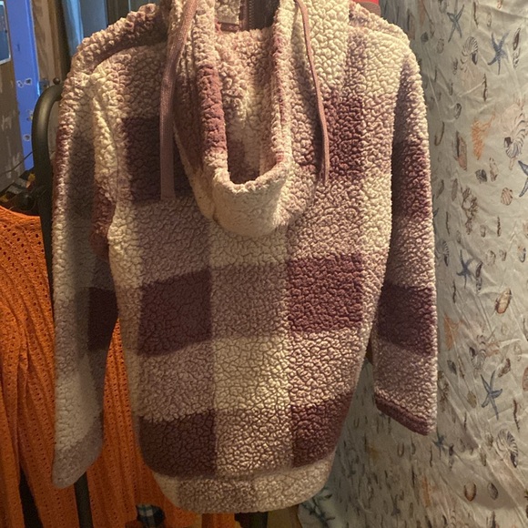 A women’s fuzzy zip up hooded sweatshirt. It’s purple and white checkered. - Picture 2 of 2